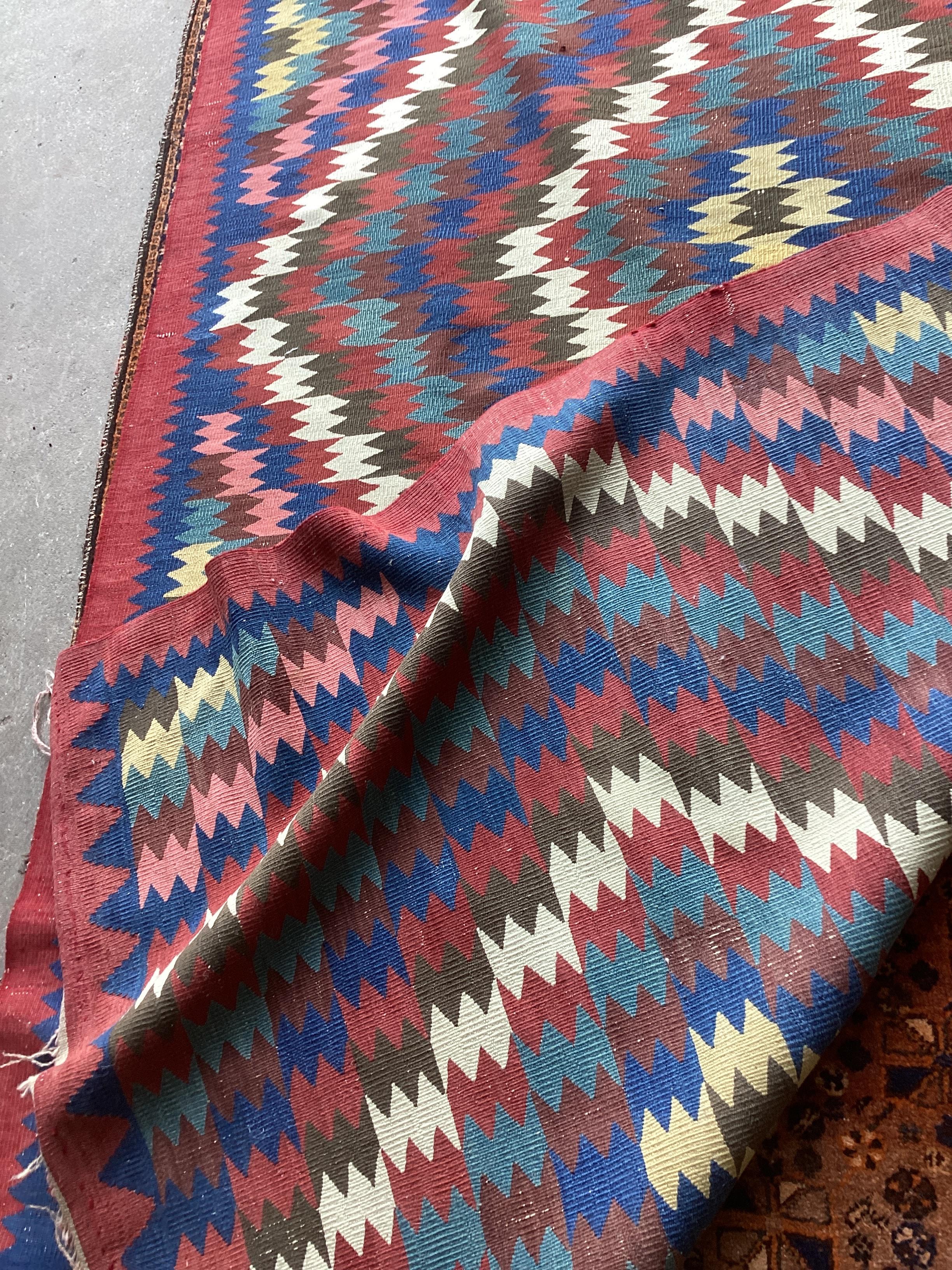 A Kelim polychrome flatweave carpet, approx. 320 x 160cm